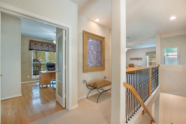 2327 Clearspring Dr N, Irving, TX 75063 - hall featuring an upstairs landing, an office area, wood finished floors, and recessed lighting