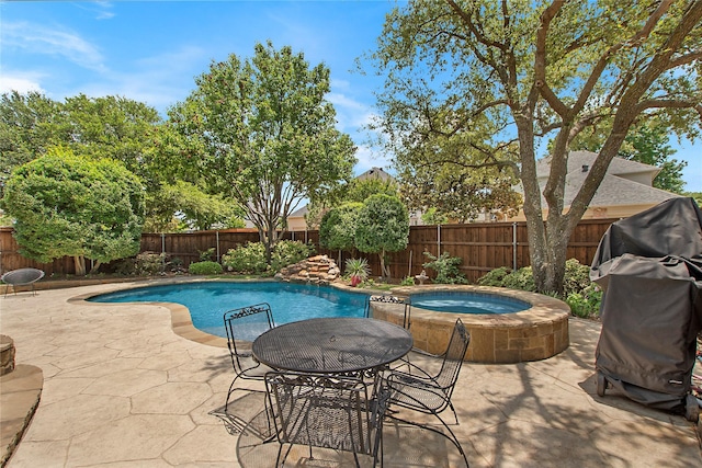 2327 Clearspring Dr N, Irving, TX 75063 - view of swimming pool with a patio, a fenced backyard, and an in-ground hot tub