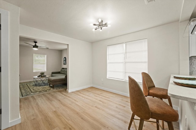 709 E Gandy St, Denison, TX 75021 - dining room featuring light wood finished floors and a ceiling fan