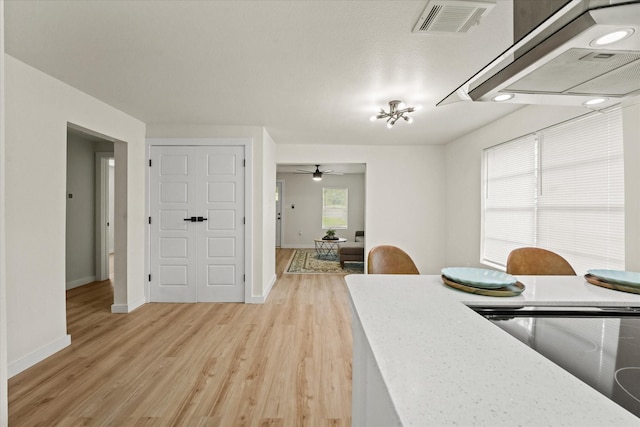 709 E Gandy St, Denison, TX 75021 - dining space with light wood-style floors and a ceiling fan