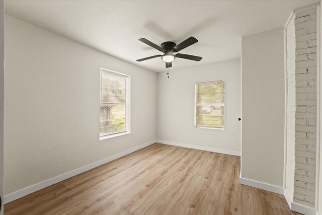 709 E Gandy St, Denison, TX 75021 - spare room featuring plenty of natural light, light wood-type flooring, and a ceiling fan