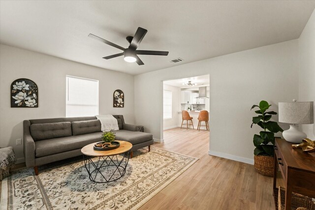 709 E Gandy St, Denison, TX 75021 - living area with plenty of natural light, light wood-style floors, and a ceiling fan