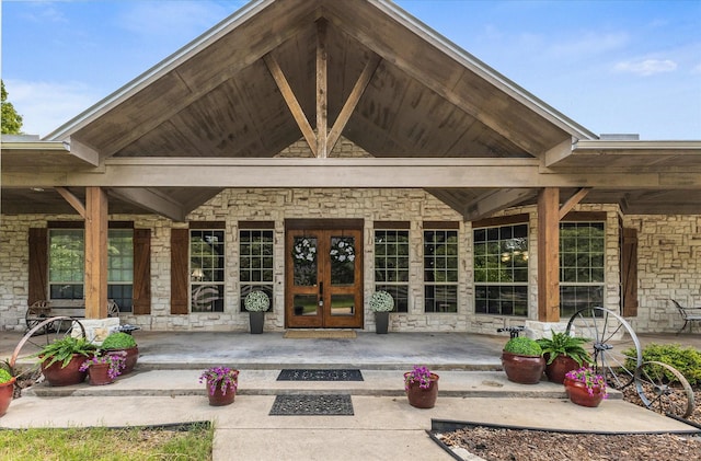 2702 Hidden Trails Rd, Royse City, TX 75189 - view of exterior entry with stone siding and french doors