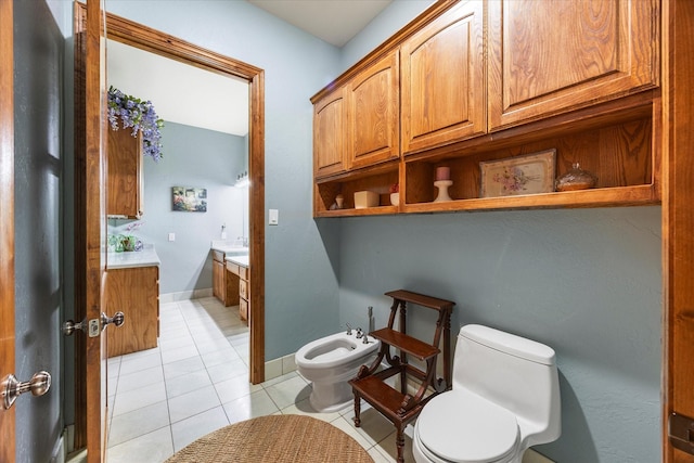 2702 Hidden Trails Rd, Royse City, TX 75189 - bathroom with vanity, a bidet, and tile patterned flooring