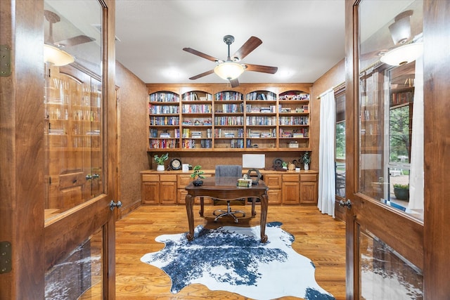 2702 Hidden Trails Rd, Royse City, TX 75189 - office space with light wood-type flooring, ceiling fan, and built in shelves