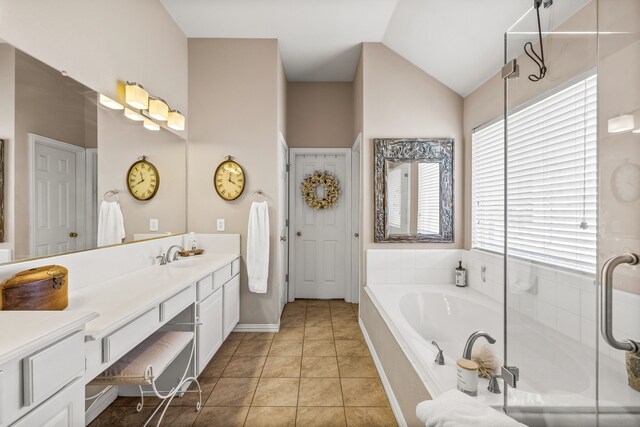8601 Prescott Cir, Frisco, TX 75034 - bathroom with vanity, a garden tub, lofted ceiling, and tile patterned flooring