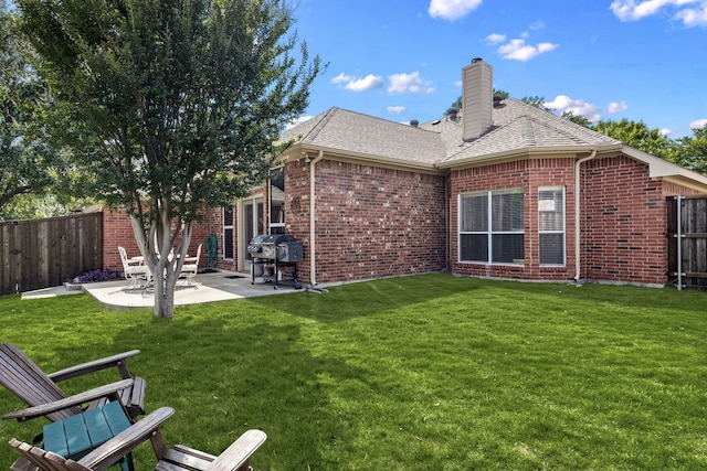 8601 Prescott Cir, Frisco, TX 75034 - rear view of property with brick siding, a patio, a fenced backyard, and roof with shingles