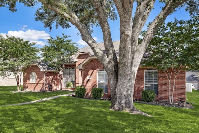 8601 Prescott Cir, Frisco, TX 75034 - view of front of house featuring brick siding and a front yard