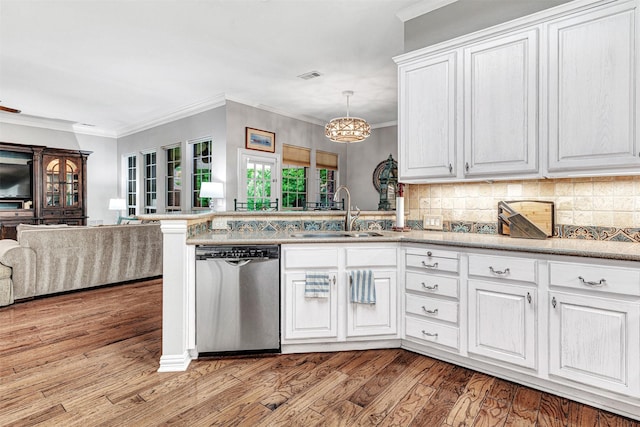 4404 Barnsley Dr, Plano, TX 75093 - kitchen featuring stainless steel dishwasher, open floor plan, white cabinetry, a chandelier, and backsplash