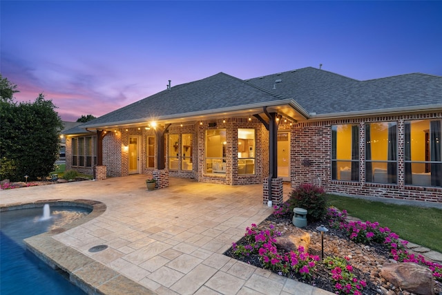 1910 Blue Forest Dr, Prosper, TX 75078 - rear view of property featuring brick siding, a patio area, and a shingled roof