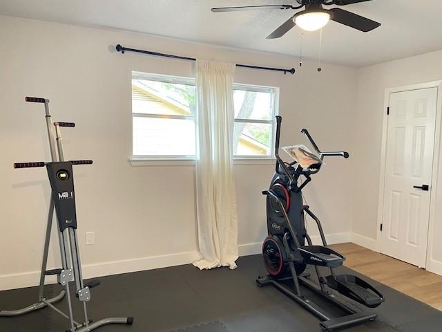 1109 Knotty Oaks Dr, Woodway, TX 76712 - exercise room with a ceiling fan and baseboards