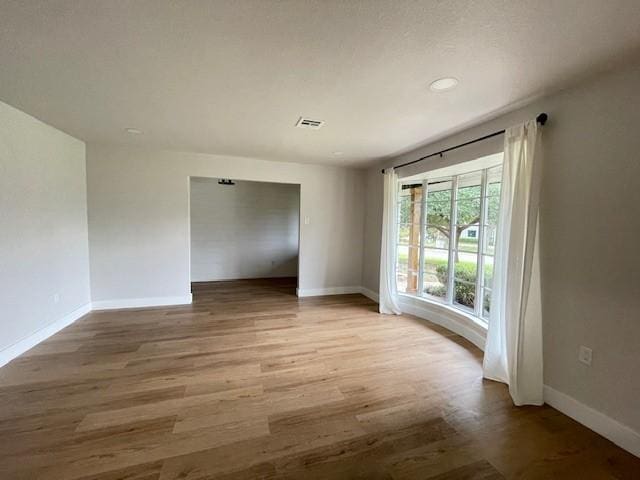 1109 Knotty Oaks Dr, Woodway, TX 76712 - empty room with light wood-type flooring and recessed lighting