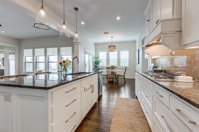 7204 Ripley St, Mckinney, TX 75071 - kitchen featuring appliances with stainless steel finishes, tasteful backsplash, dark wood-type flooring, recessed lighting, and a center island with sink