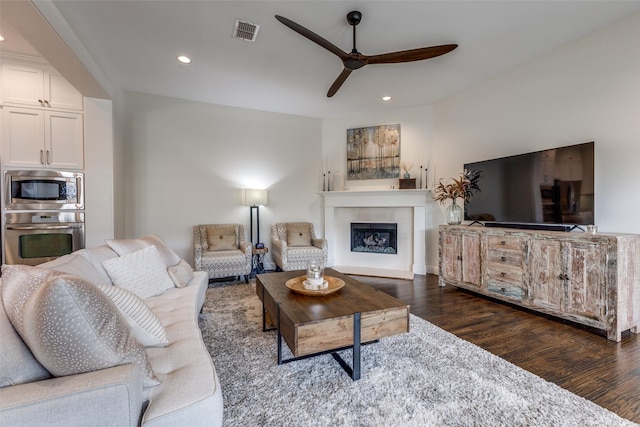7204 Ripley St, Mckinney, TX 75071 - living area featuring a ceiling fan, dark wood finished floors, recessed lighting, and a fireplace