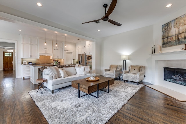 7204 Ripley St, Mckinney, TX 75071 - living room with ceiling fan, dark wood-type flooring, recessed lighting, and a fireplace