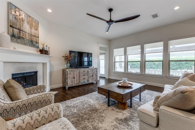 7204 Ripley St, Mckinney, TX 75071 - living area featuring healthy amount of natural light, a ceiling fan, wood finished floors, a fireplace, and recessed lighting
