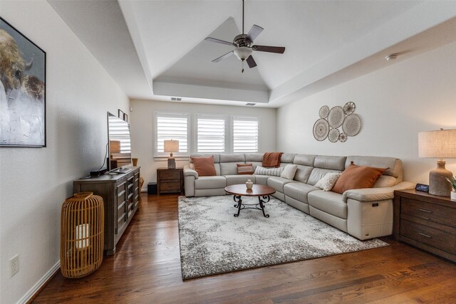 7204 Ripley St, Mckinney, TX 75071 - living area featuring ceiling fan, a raised ceiling, and dark wood-style floors