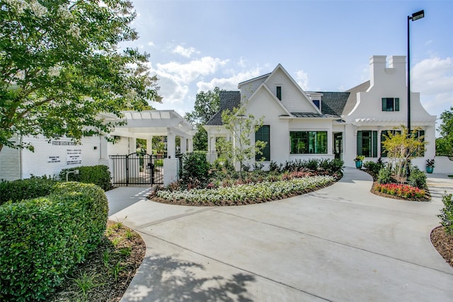 7204 Ripley St, Mckinney, TX 75071 - view of front of house featuring a gate, a pergola, a standing seam roof, and roof with shingles