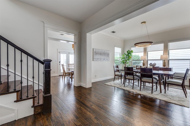 7204 Ripley St, Mckinney, TX 75071 - dining room with stairs, wood finished floors, and crown molding