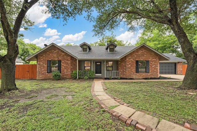 402 2nd St, Moody, TX 76557 - view of front facade with brick siding, covered porch, an attached garage, and roof with shingles