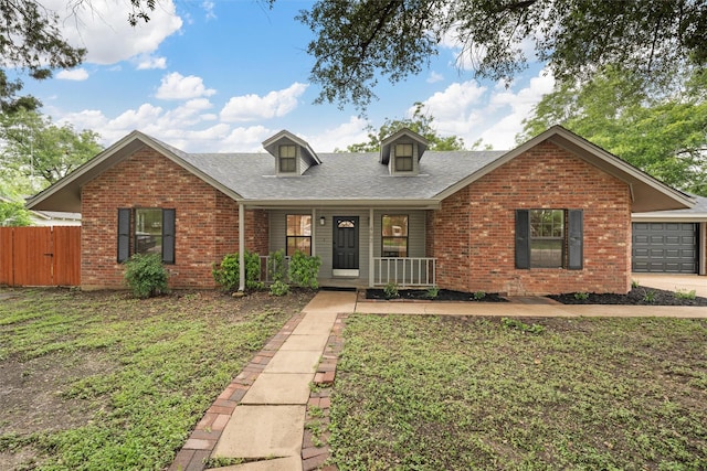 402 2nd St, Moody, TX 76557 - view of front facade with brick siding, covered porch, roof with shingles, and a garage