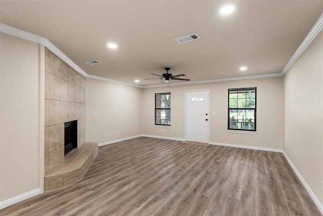 402 2nd St, Moody, TX 76557 - unfurnished living room featuring recessed lighting, ornamental molding, ceiling fan, light wood-type flooring, and a tile fireplace