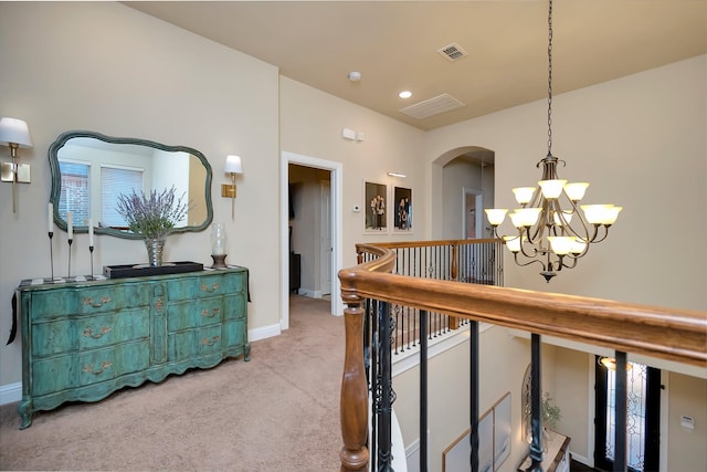 1844 Halifax St, Roanoke, TX 76262 - hallway featuring a chandelier, carpet, an upstairs landing, and arched walkways