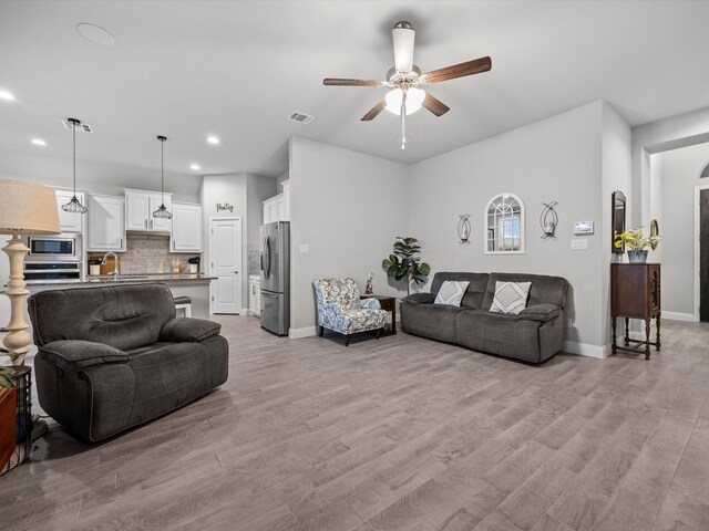 5622 Log Cabin Ct, Midlothian, TX 76065 - living area with ceiling fan, recessed lighting, and light wood-type flooring