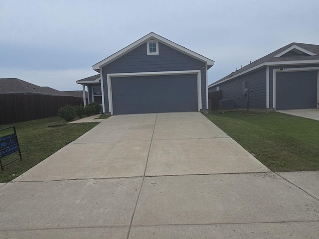 704 Dashwood Dr, Princeton, TX 75407 - ranch-style home with a front yard, a garage, and concrete driveway