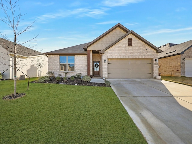 2309 Loch Ness Ln, Denton, TX 76207 - view of front of property featuring brick siding, driveway, a garage, and a front lawn