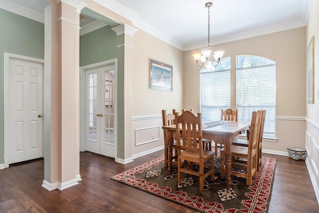 1023 Muirfield Dr, Mansfield, TX 76063 - dining room with decorative columns, dark wood finished floors, crown molding, a chandelier, and french doors