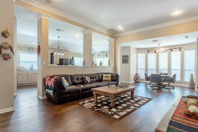 1023 Muirfield Dr, Mansfield, TX 76063 - living area with ornate columns, dark wood-style flooring, crown molding, and a ceiling fan