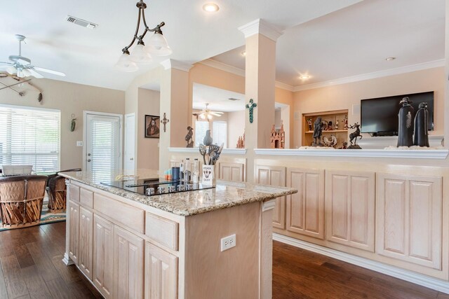 1023 Muirfield Dr, Mansfield, TX 76063 - kitchen featuring a ceiling fan, black electric cooktop, dark wood-style flooring, a center island, and healthy amount of natural light