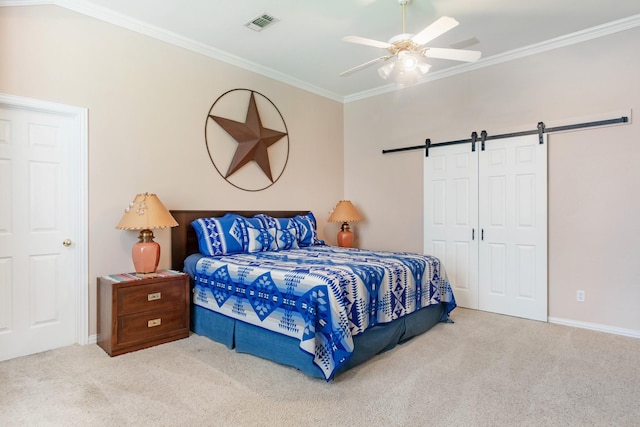 1023 Muirfield Dr, Mansfield, TX 76063 - carpeted bedroom with a barn door, ornamental molding, a ceiling fan, and a closet