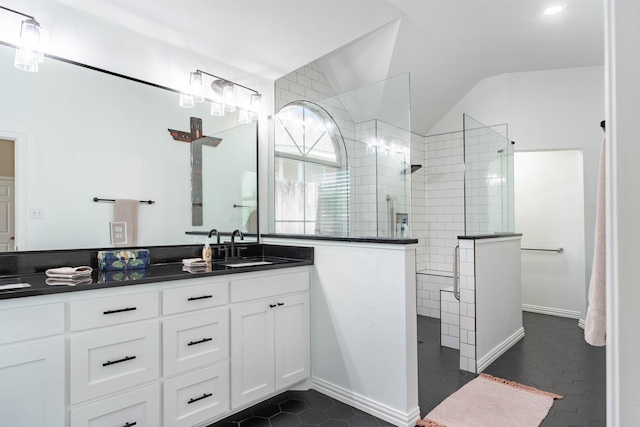1023 Muirfield Dr, Mansfield, TX 76063 - full bathroom featuring double vanity, walk in shower, vaulted ceiling, and tile patterned flooring