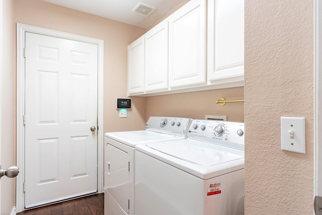 1023 Muirfield Dr, Mansfield, TX 76063 - laundry area with washer and clothes dryer, cabinet space, and dark wood finished floors