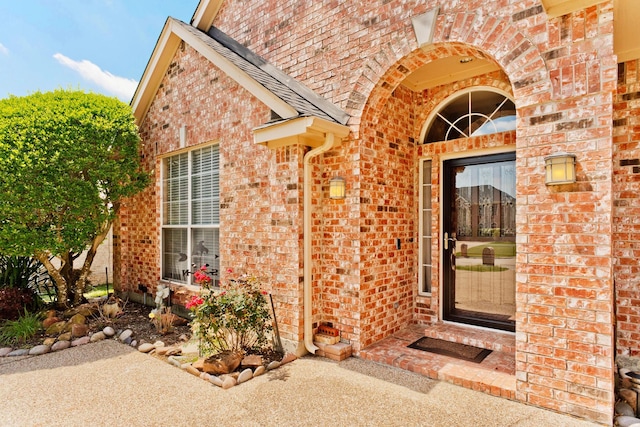 1023 Muirfield Dr, Mansfield, TX 76063 - view of exterior entry featuring brick siding