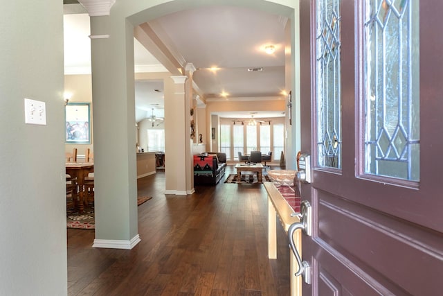1023 Muirfield Dr, Mansfield, TX 76063 - entrance foyer with ornate columns, ornamental molding, dark wood-type flooring, and arched walkways