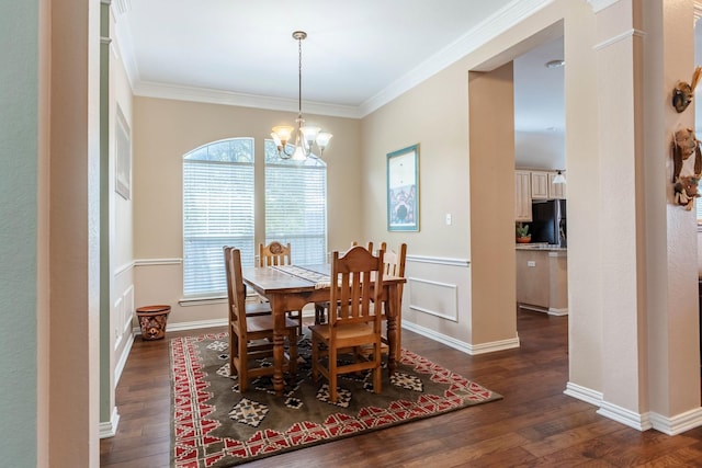 1023 Muirfield Dr, Mansfield, TX 76063 - dining space with dark wood-style floors, a chandelier, and ornamental molding