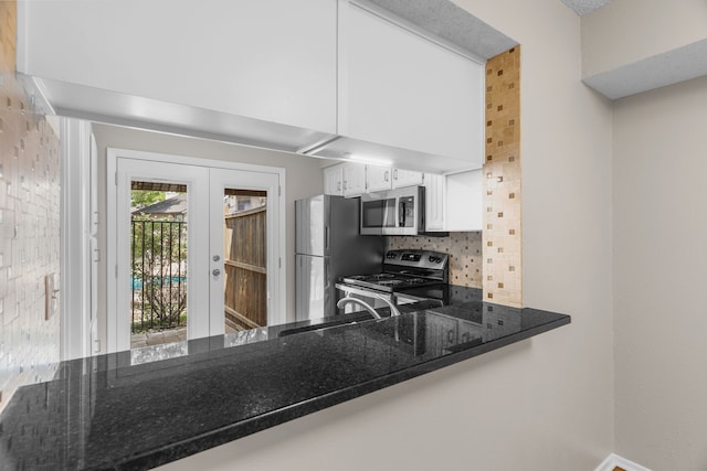 333 Melrose Dr Unit 4D, Richardson, TX 75080 - kitchen featuring stainless steel appliances, backsplash, dark stone counters, french doors, and white cabinets