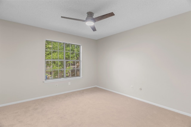 333 Melrose Dr Unit 4D, Richardson, TX 75080 - spare room with light colored carpet, ceiling fan, and a textured ceiling