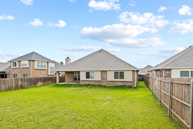 1020 Broken Wheel Trl, Aubrey, TX 76227 - back of house with brick siding, a fenced backyard, a chimney, and roof with shingles