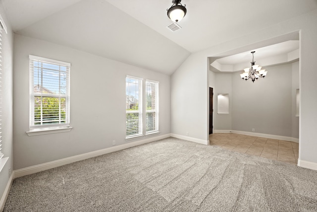 1020 Broken Wheel Trl, Aubrey, TX 76227 - spare room featuring carpet, a chandelier, tile patterned floors, and lofted ceiling