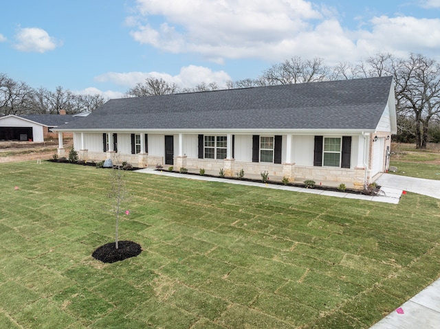 113 Aslan Rd, Poolville, TX 76487 - view of front of home featuring a shingled roof, a front yard, stone siding, and driveway