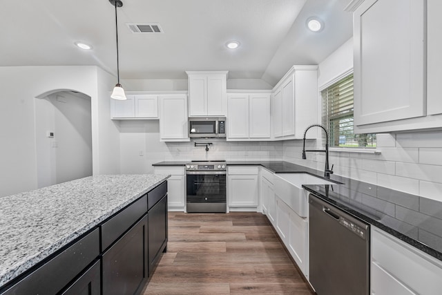 113 Aslan Rd, Poolville, TX 76487 - kitchen with stainless steel appliances, white cabinetry, light stone counters, dark wood finished floors, and hanging light fixtures