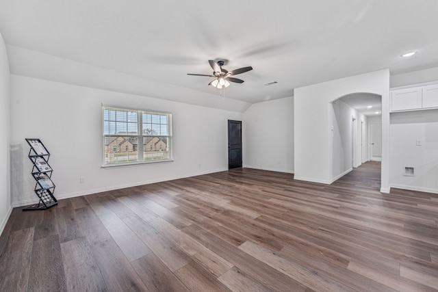 113 Aslan Rd, Poolville, TX 76487 - unfurnished living room with ceiling fan, arched walkways, wood finished floors, and recessed lighting