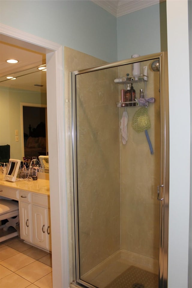 4739 Fairfield Ave Unit 4, Shreveport, LA 71106 - ensuite bathroom featuring crown molding, vanity, a stall shower, and tile patterned flooring