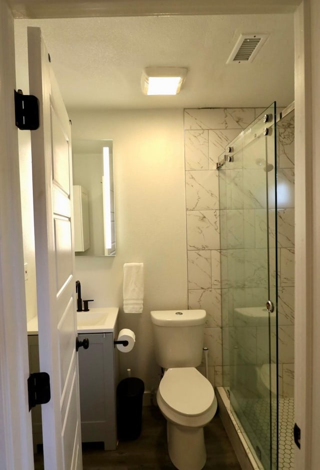 3612 Mt Vernon Ave, Fort Worth, TX 76103 - full bath with vanity, a marble finish shower, and wood finished floors