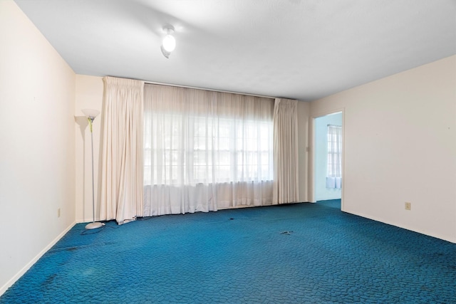 200 Hillcrest Ct, Irving, TX 75062 - carpeted empty room featuring baseboards