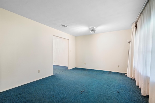 200 Hillcrest Ct, Irving, TX 75062 - empty room with dark carpet and baseboards